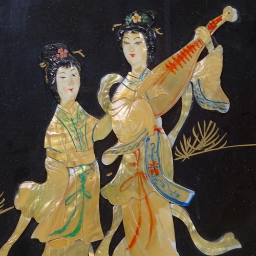 825 - A pair of Oriental panels with applied figures, height 70cm