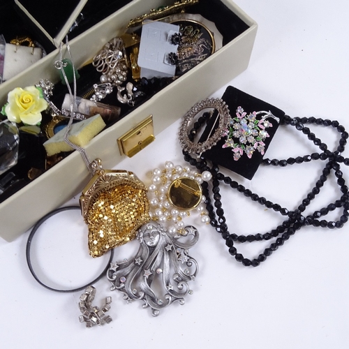 860 - A quantity of costume jewellery, compact etc