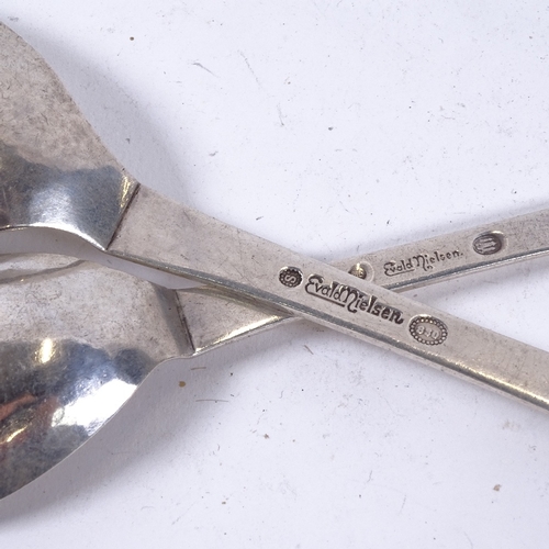 903 - EVALD NIELSEN - a Vintage graduated pair of Danish stylised silver spoons, relief floral decoration ... 