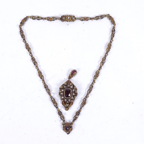 927 - An Austro-Hungarian necklace and pendant set with garnets and seed pearls (A/F)