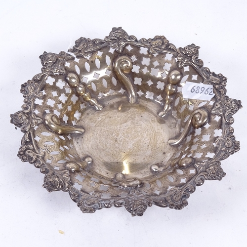 943 - An Edward VII silver dish with embossed and pierced decoration, Chester 1906, 4.2oz