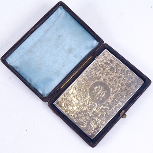 956 - A Victorian silver card case, with allover scrolled and embossed decoration, Birmingham 1886, in ori... 