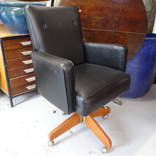 1953 - A Danish rexine upholstered swivel desk chair