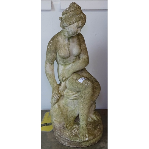 1954 - A weathered concrete garden statue, figure of a seated lady, H62cm