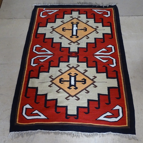 1959 - A red ground Kilim rug with geometric pattern, 180cm x 115cm