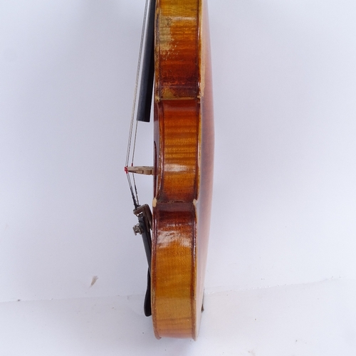 311 - An early/mid-20th century Stradivarius copy violin and bow, in hardshell case, violin length 60cm