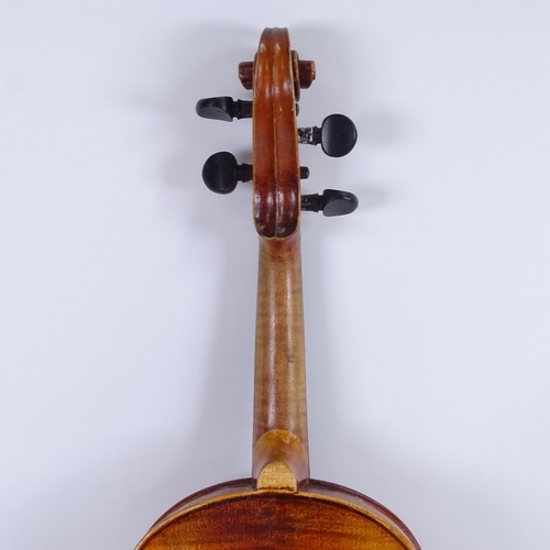 311 - An early/mid-20th century Stradivarius copy violin and bow, in hardshell case, violin length 60cm