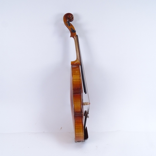 311 - An early/mid-20th century Stradivarius copy violin and bow, in hardshell case, violin length 60cm