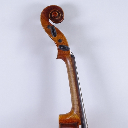 311 - An early/mid-20th century Stradivarius copy violin and bow, in hardshell case, violin length 60cm