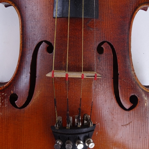 311 - An early/mid-20th century Stradivarius copy violin and bow, in hardshell case, violin length 60cm