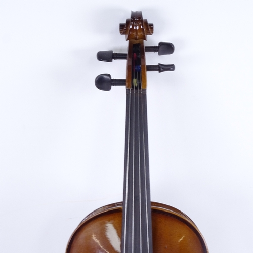 712 - A violin and bow in case