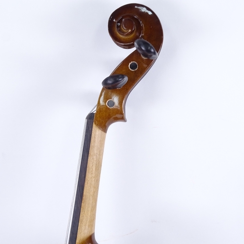 712 - A violin and bow in case