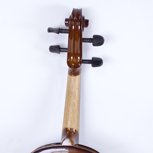 712 - A violin and bow in case