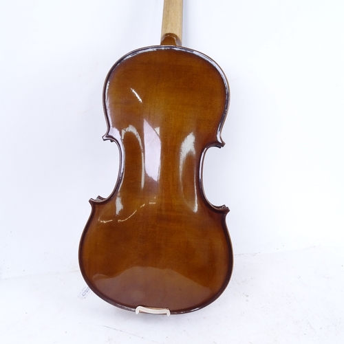 712 - A violin and bow in case