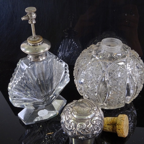 112 - An Art Deco cut-glass silver-topped atomiser scent bottle, and a Victorian cut-glass scent bottle, w... 