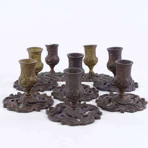 119 - A set of 8 French patinated bronze candlesticks, late 19th/early 20th century, height 9cm, base diam... 