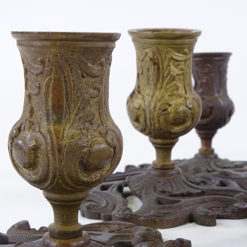 119 - A set of 8 French patinated bronze candlesticks, late 19th/early 20th century, height 9cm, base diam... 