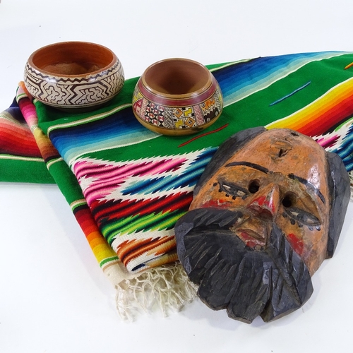 120 - A large hand woven Mexican Saltillo Serape (blanket), a carved and painted wood mask, a pair of pain... 