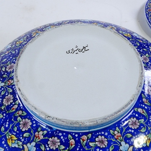 125 - A Persian hand painted enamel bowl and cover, height 20cm, diameter 20cm, and a gilded blue glass pe... 