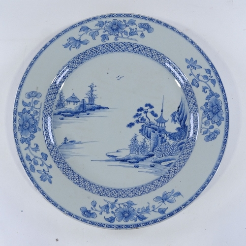 128 - A Chinese blue and white porcelain charger, hand painted landscape designs, diameter 35cm