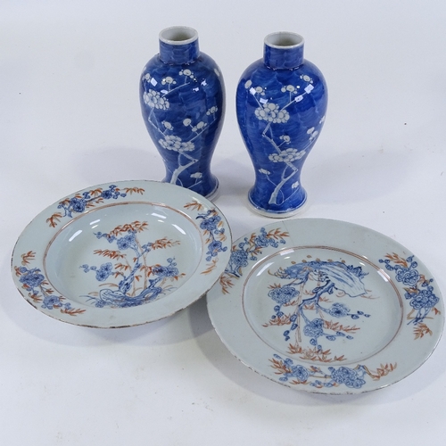 130 - A pair of Chinese porcelain plates with blue red and gilt painted decoration, diameter 23cm, and a p... 