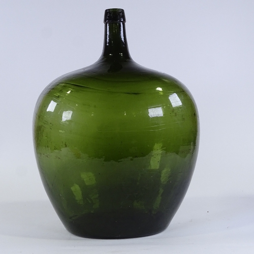 133 - A large Antique handblown green glass carboy, height 46cm