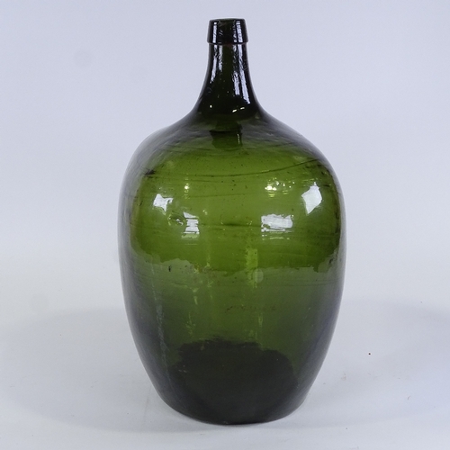 133 - A large Antique handblown green glass carboy, height 46cm