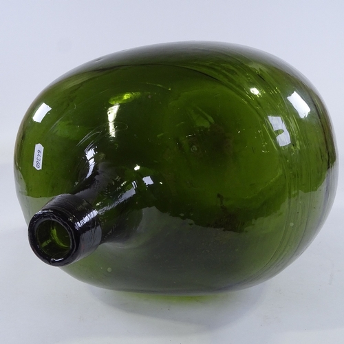 133 - A large Antique handblown green glass carboy, height 46cm