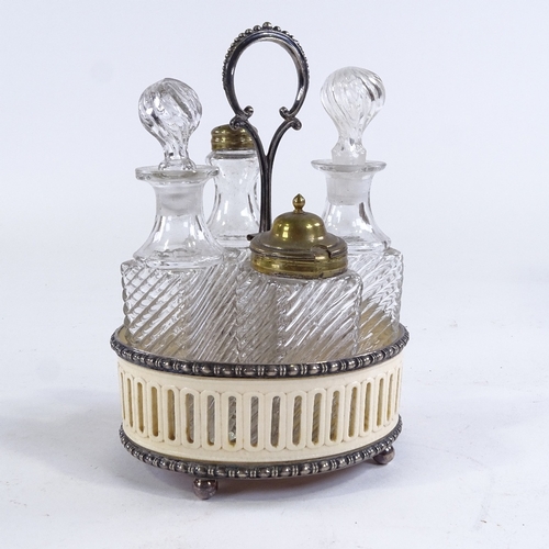 153 - An unusual Victorian ivory and silver plate cruet stand, containing 4 pressed glass cruet bottles