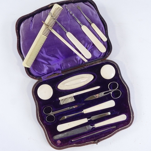 154 - A leather-cased ivory manicure set, and another manicure case (2)