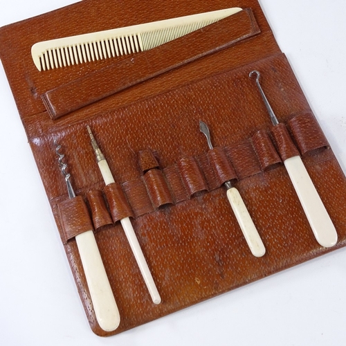 154 - A leather-cased ivory manicure set, and another manicure case (2)