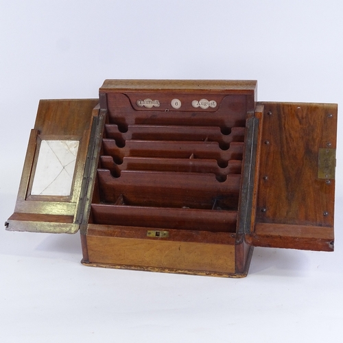 157 - A Victorian walnut slope-front stationery cabinet with perpetual calendar, width 32cm