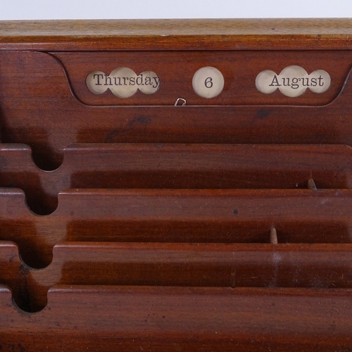 157 - A Victorian walnut slope-front stationery cabinet with perpetual calendar, width 32cm