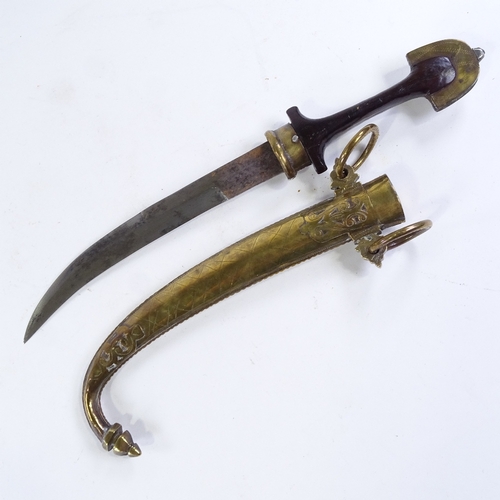 163 - A 19th century Middle Eastern jambiya knife, silver-mounted carved wood hilt, with original brass an... 