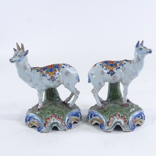 180 - A pair of Dutch Delft tin glaze pottery stag and doe ornaments, height 15cm