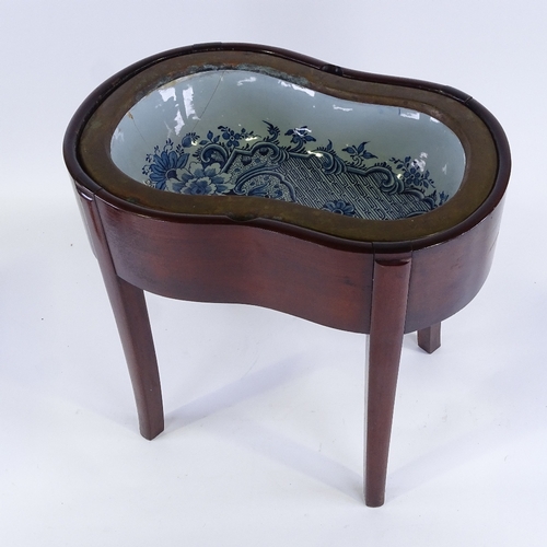 182 - An Antique mahogany bidet with Delft blue and white pottery liner, length 48cm