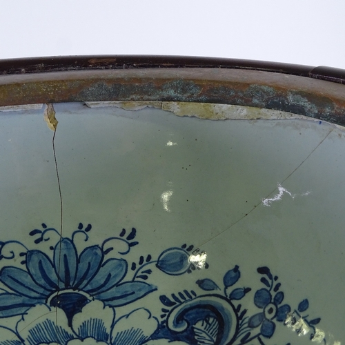 182 - An Antique mahogany bidet with Delft blue and white pottery liner, length 48cm