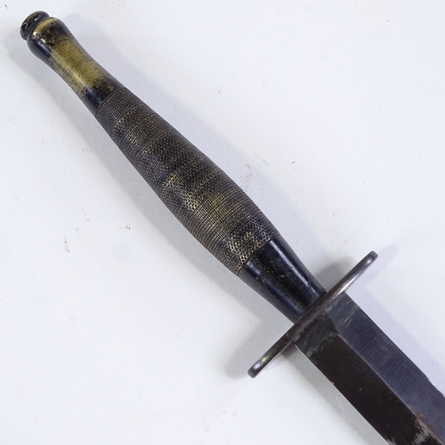 204 - A Vintage Fairbairn Sykes Commando knife, with leather sheath