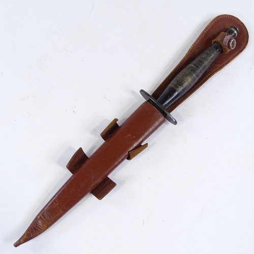 204 - A Vintage Fairbairn Sykes Commando knife, with leather sheath