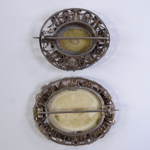 222 - 2 similar Continental silver filigree brooches, with inset miniature paintings on ivory, largest 5cm... 