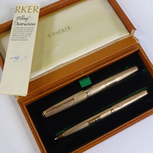 226 - Parker, 9ct gold fountain pen and ballpoint pen set, original leather case