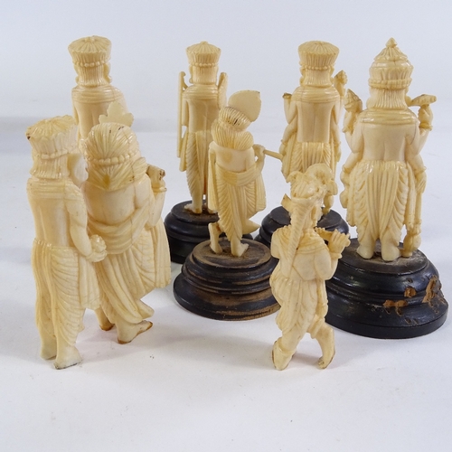 230 - A group of Indian carved ivory figures, some on wooden stands, height 8cm (8)