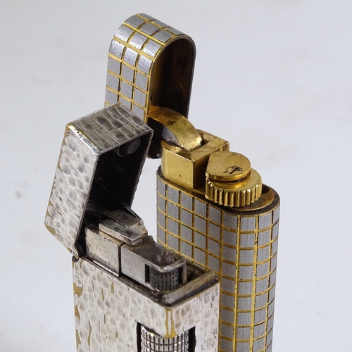 233 - A Cartier pocket lighter, serial no. 31275T, and a Dunhill textured design pocket lighter (2)