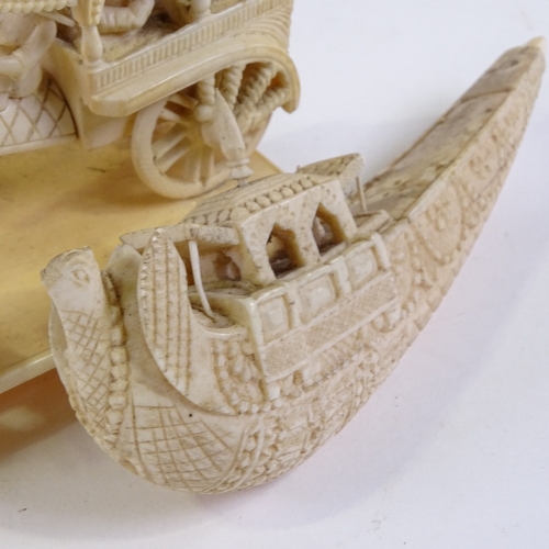 235 - An Indian ivory carving, ox-drawn carriage, length 11cm, and an Indian carved ivory pleasure boat, l... 