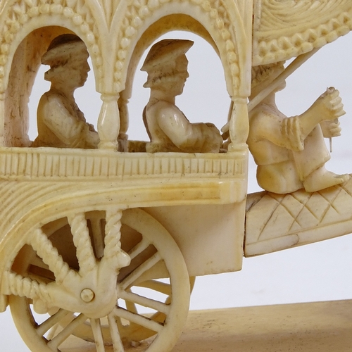 235 - An Indian ivory carving, ox-drawn carriage, length 11cm, and an Indian carved ivory pleasure boat, l... 