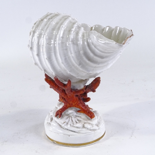 251 - A Copeland China nautilus shell design table centre, on coral design base, height 22cm