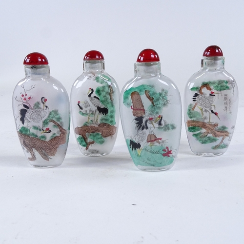 262 - A set of 4 Chinese internally painted glass snuff bottles, height 7.5cm