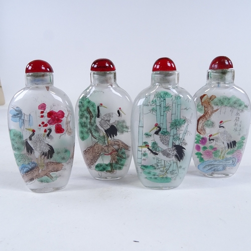 262 - A set of 4 Chinese internally painted glass snuff bottles, height 7.5cm