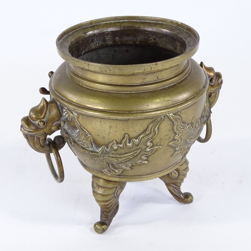 273 - A Chinese polished bronze jardiniere, with relief cast dragon frieze, on 3 elephant feet, rim diamet... 