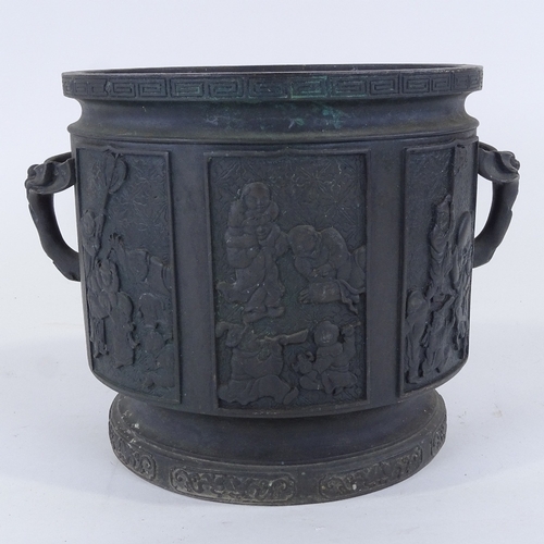 275 - A Chinese patinated bronze jardiniere, with relief moulded panels, rim diameter 26cm, height 24cm